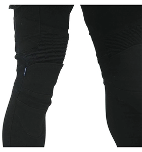 Detail view of black motorcycle jeans with ribbed expansion panels for knee flexibility