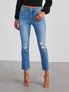 High-waisted slim fit distressed light blue denim jeans for women with ripped details