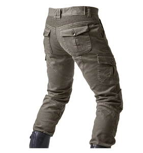 Detail view of military green tactical motorcycle pants with stretch panels and large pockets