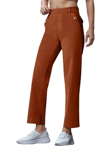 Women's high waist wide leg trousers in rust orange with decorative button details