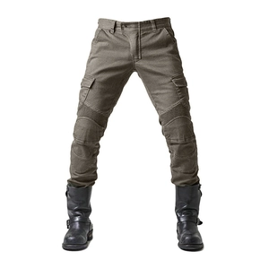 Close-up of olive motorcycle jeans featuring reinforced knee pleats and cargo side pockets