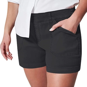 Detail of high-waisted black denim shorts featuring deep side pockets and slim fit design