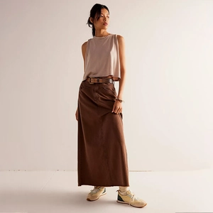 Detail of loose denim maxi skirt with belt and sleeveless top for a vintage casual look