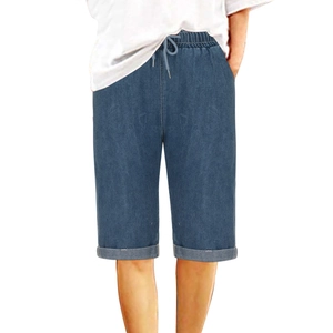 Close-up of deep blue denim shorts featuring drawstring waistband and rolled cuffs details