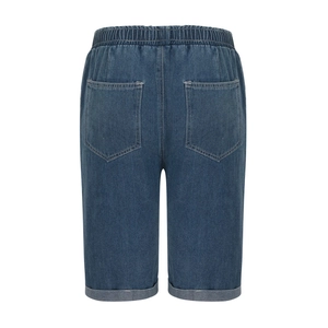 Detail of deep blue denim shorts featuring elastic drawstring waist and cuffed hems