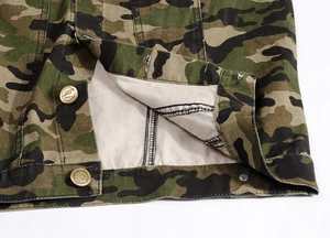 Detailed view of camouflage denim vest featuring embossed metal buttons and fine stitching