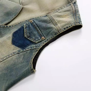 Slim fit men's vintage denim vest featuring heavy distressed wash and patchwork details