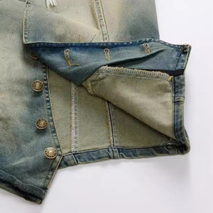 Slim fit denim vest for men featuring vintage wash details and embossed metal buttons