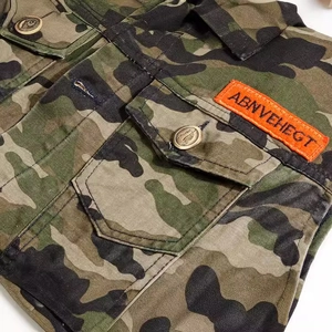 Slim fit men's camouflage denim vest featuring flap pockets and metallic buttons