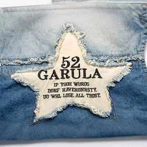 Men's slim fit blue denim vest with star patch embroidery and distressed details