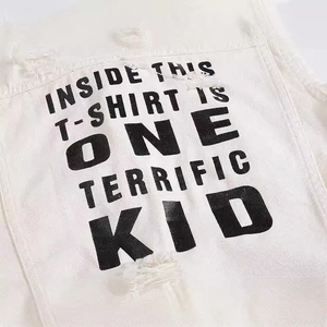 White slim-fit denim vest featuring distressed ripped details and black slogan print