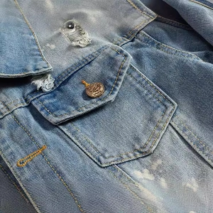 Slim fit light blue denim jacket for men featuring distressed details and anchor metal button