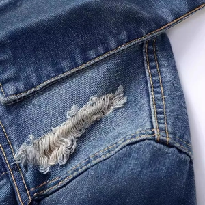 Slim fit washed denim jacket for men featuring distressed ripped details and orange stitching