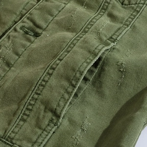 Slim fit army green denim vest for men featuring distressed details and double stitching