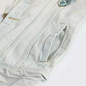 Slim fit light blue denim vest with a gold heart-shaped button and pocket detail