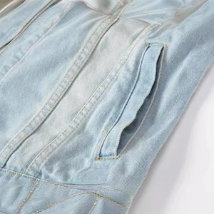 Slim fit light blue denim vest for men with contrast stitching and pocket details