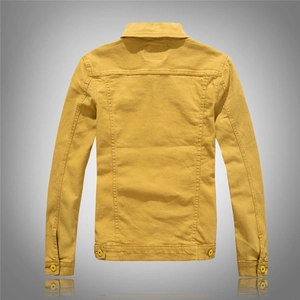 Detail view of mustard yellow denim jacket back with reinforced seams and hem tabs
