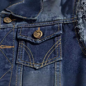 Slim fit blue denim vest for men featuring distressed details and yellow contrast stitching