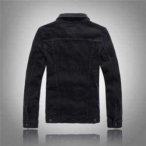 Back view of black slim fit denim jacket with reinforced seams and adjustable hem buttons