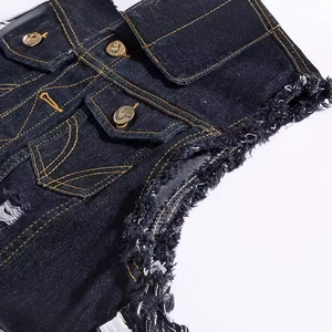Black distressed denim vest featuring contrast yellow stitching and frayed edges details