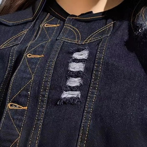 Slim fit dark blue denim vest featuring vintage distressed rips and yellow contrast stitching