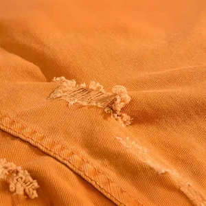 Gilet en jean orange pour hommes coupe ajustée avec détails déchirés et texture sergé