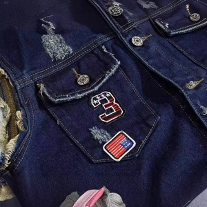 Slim fit blue denim vest with vintage distressed patches and metal buttons