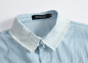 Detail of light blue denim shirt collar featuring distressed raw fringe edges for men