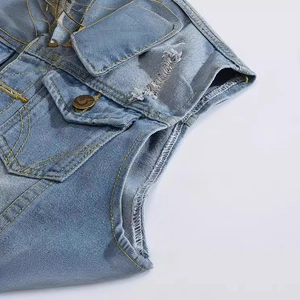 Slim fit light blue distressed denim vest for men with ripped details and chest pocket
