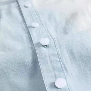 Light blue denim vest for men with fine woven texture and translucent buttons