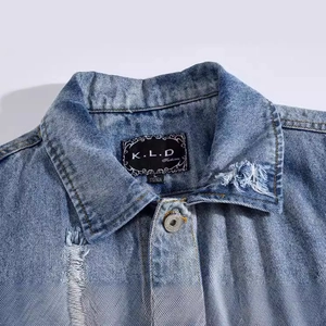 Men's slim-fit light blue washed denim vest with embroidery and distressed ripped details