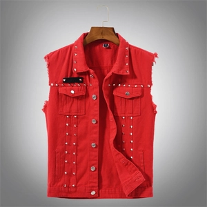 Detail of red denim vest featuring silver studs on collar and frayed edge armholes
