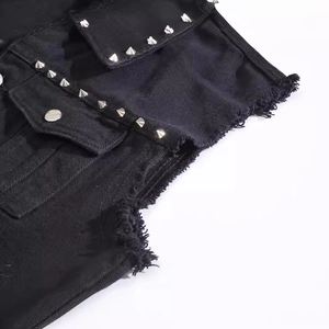 Men's black punk denim vest featuring raw edges and silver cone metal rivets