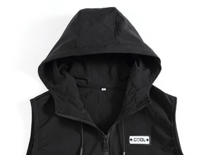 Close-up of black hooded men's vest showing the COOL patch and zipper detail