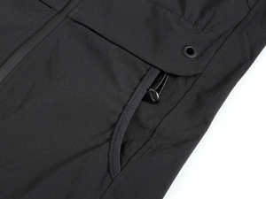 Detail of waterproof technical fabric with drawstring pocket and metallic eyelet details