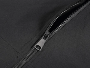 Detail of durable ripstop nylon fabric and premium black metal zipper on men's vest