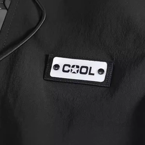 Men's techwear casual black vest featuring a stylish COOL patch and ripstop fabric texture