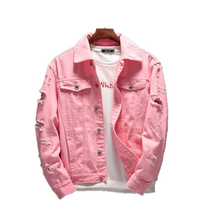 Pink oversized distressed denim jacket with ripped details and chest pockets