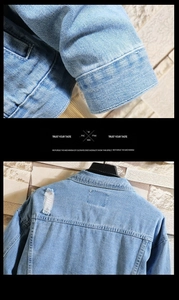 Detail of light blue washed denim jacket featuring distressed ripped texture and stitching