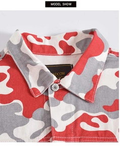Close-up of red camo denim jacket collar with metal button and inner brand label detail