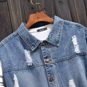 Mens loose knit denim jacket with vintage wash and distressed ripped details on shoulders