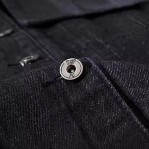 Men's slim black denim vest featuring premium metal buttons and high-density fabric texture