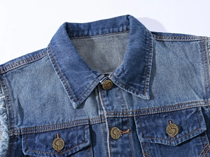 Detail of blue denim vest collar and copper buttons with distressed frayed armholes