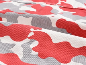 Close-up of high-quality red camouflage twill cotton fabric with detailed texture
