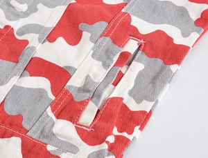 Close-up of red camouflage jacket featuring twill fabric and side pocket with double stitching