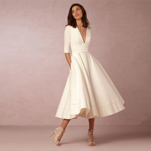 Elegant white V-neck midi dress with half sleeves and a flared A-line satin skirt