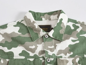 Detailed view of camouflage denim jacket with classic collar and brand label
