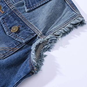 Men's slim fit blue denim vest featuring heavy distressed frayed edges and vintage buttons