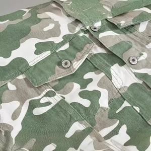 Men's green camouflage denim jacket with cargo chest pockets and metal buttons