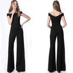 Close-up of the elegant off-shoulder neckline and tailored back zipper on this black jumpsuit